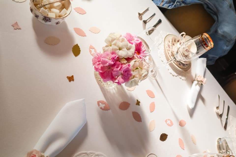 Tea table with flowers and place settings